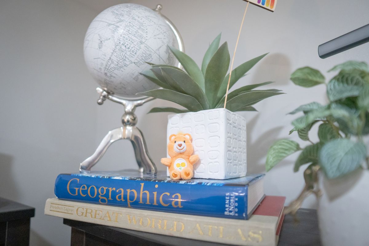 Globe and plant on a stack of atlases